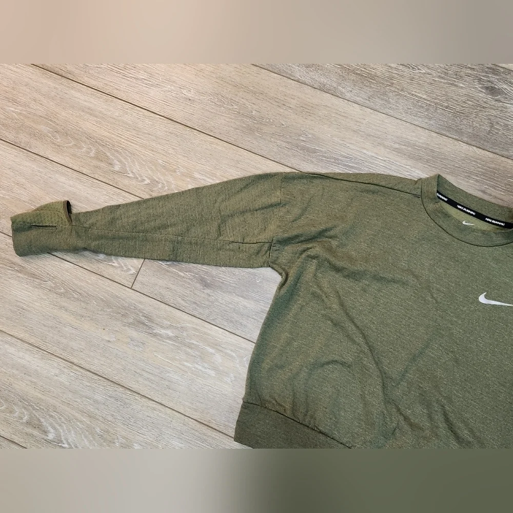 The Nike Running Women's Dri-Fit Crop Top Sweater in size Xsmall and olive green